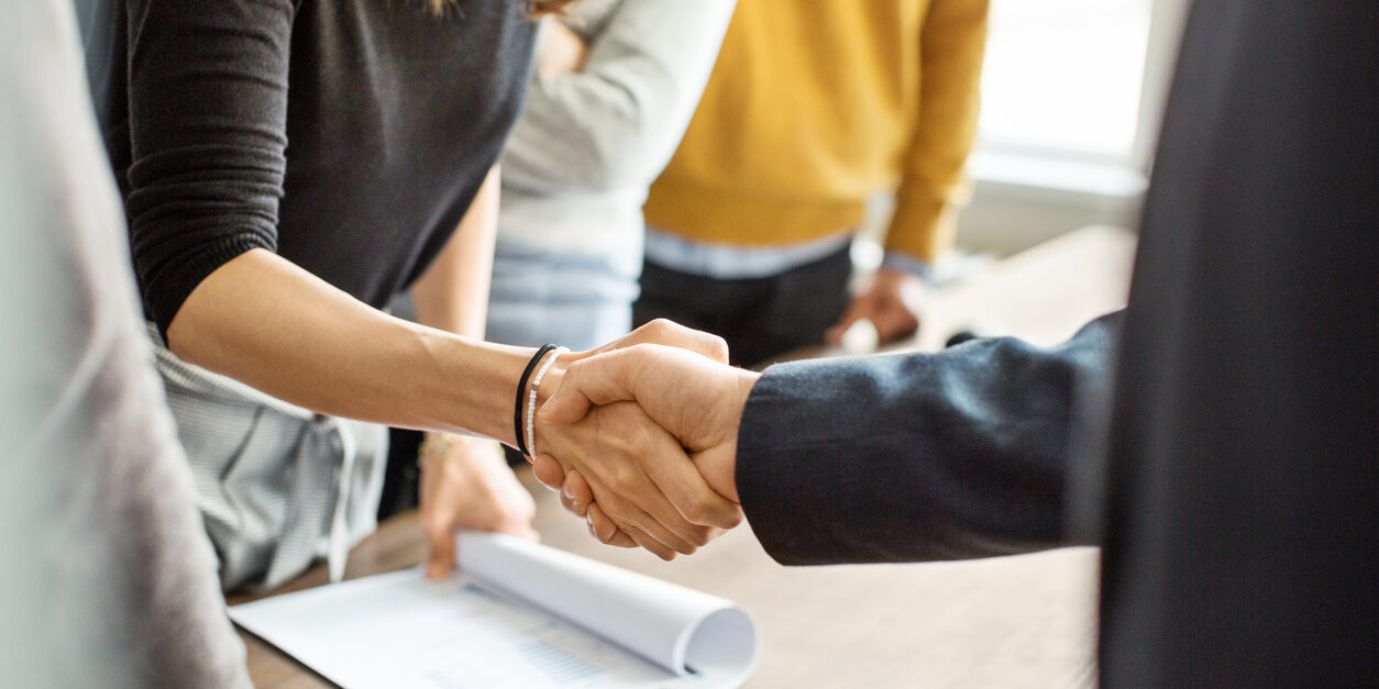 Business people shaking hands in office